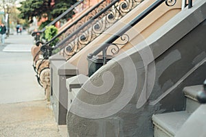 Brownstone Houses lined up stairways during golden hour for real estate