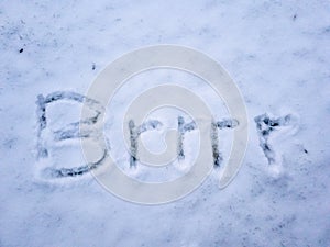 Brrr written in the freshly fallen snow