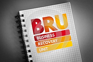 BRU - Business Recovery Unit acronym on notepad, business concept background