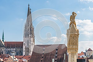 The Bruckmandl the landmark of Regensburg looks towards the cathedral, Germany