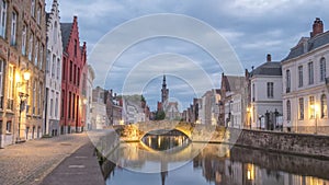 Bruges Belgium city skyline day to night time lapse at Spiegelrei Canal