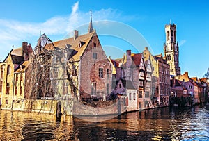 Bruges, Belgium. Image with Rozenhoedkaai in Brugge, Dijver river canal and Belfort (Belfry) tower