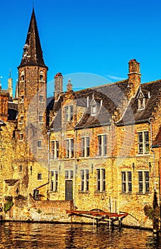 Bruges, Belgium. Image with Rozenhoedkaai in Brugge, Dijver river canal and Belfort (Belfry) tower