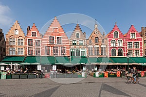 BRUGES, BELGIUM - MARCH 23, 2015. Tourists in north side of Grote Markt (Market Square) of Bruges, Brugge, with enchanting street