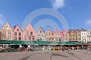 BRUGES, BELGIUM - MARCH 23, 2015. Tourists in north side of Grote Markt (Market Square) of Bruges, Brugge, with enchanting street