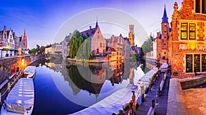 Bruges, Belgium. Rozenhoedkaai illuminated at night, old town with Belfry reflection