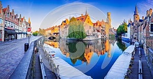 Bruges, Belgium. Rozenhoedkaai illuminated at night, old town with Belfry reflection