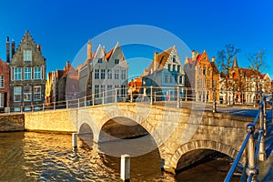 Bruges canal and bridge in the morning, Belgium photo