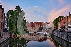 Bruges canal and houses at sunset. Brugge famous place, Belgium
