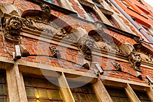 Bruges, Flanders, Belgium, Europe - October 1, 2019. Details of facades medieval old brick houses on the ancient streets in