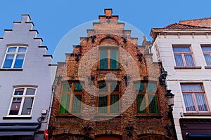 Bruges, Flanders, Belgium, Europe - October 1, 2019. Details of facades medieval old brick houses on the ancient streets in