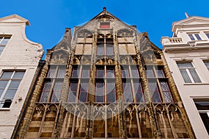 Bruges, Flanders, Belgium, Europe - October 1, 2019. Facades of old brick buildings on the medieval ancient  Market Place Market