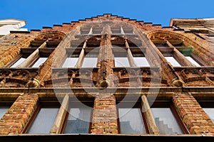 Bruges, Flanders, Belgium, Europe - October 1, 2019. Facades of old brick buildings on the medieval ancient  Market Place Market