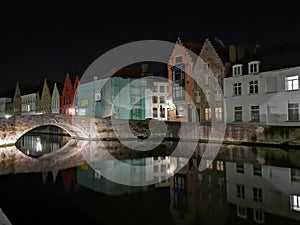 Bruges at night. Medieval city, reflexion on water