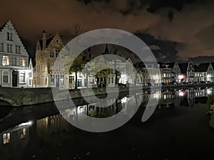 Bruges at night. Medieval city, reflexion on water
