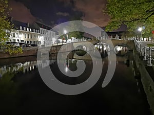 Bruges at night. Medieval city, reflexion on water