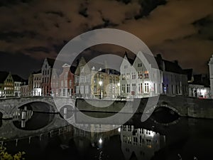 Bruges at night. Medieval city, reflexion on water