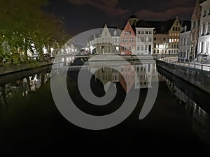 Bruges at night. Medieval city, reflexion on water