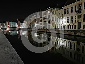 Bruges at night. Medieval city, reflexion on water