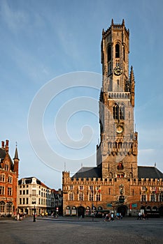 Brugge Belfry tower and Grote markt square in Bruges, Belgium on sunset