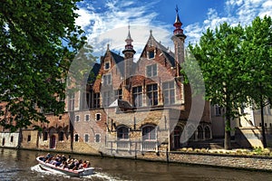 Tourist boat on canal Spiegelrei, Bruges, Belgium