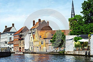 Tourist boat on canal Spiegelrei, Bruges, Belgium