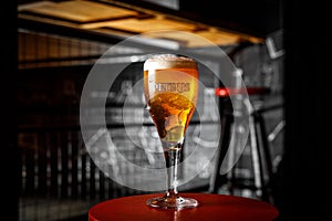 Brugge, Belgium - Ocober 20, 2019: Glass of Belgium Petrus Beer in bar