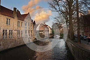 Brugge evening cityscape. Old buildings at water channel in Bruges