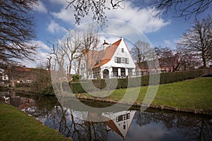 Brugge - medieval house over a canal in Bruges, Belgium