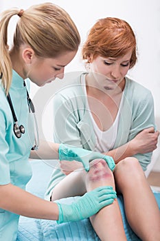 Bruised woman in doctor's office