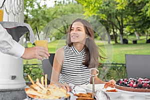 Brunch Choice Dining Food Options Eating Concept. Couple having a brunch with sparkling wine outdoors.