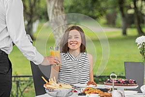 Brunch Choice Dining Food Options Eating Concept. Couple having a brunch with sparkling wine outdoors.