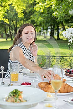 Brunch Choice Dining Food Options Eating Concept. Couple having a brunch with sparkling wine outdoors.