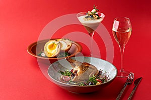 Brunch Dinner menu. Snack - Scottish Eggs, fried quail and Dessert - Trio Muss red background. photo