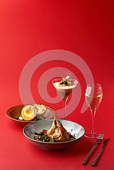 Brunch Dinner menu. Snack - Scottish Eggs, fried quail and Dessert - Trio Muss red background. photo