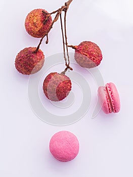 Brunch of ripe lychee and lychee macaroons with leaf isolate on