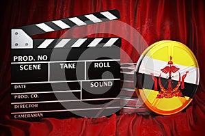 Bruneian cinematography, film industry, cinema in Brunei. Clapperboard with and film reels on the red fabric, 3D rendering