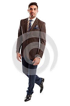 Brunet male model wearing elegant and fashionable suit