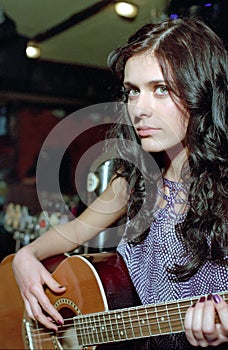 Brunet woman with guitar