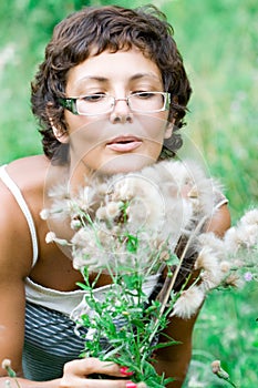 Brunet woman in a meadow