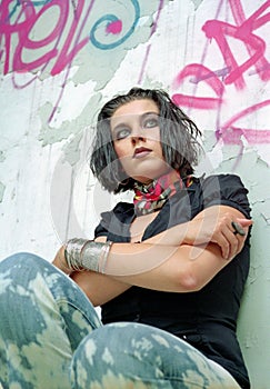 Brunet woman sitting in old house