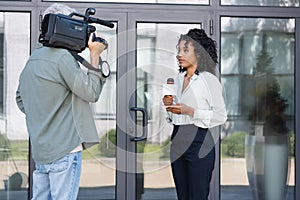 brunette african american journalist doing reportage