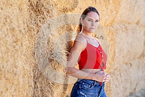 Brunette Beauty in Golden Fields: A Captivating Pose Under Azure Skies