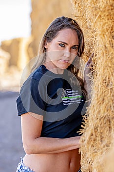 Brunette Beauty in Golden Fields: A Captivating Pose Under Azure Skies