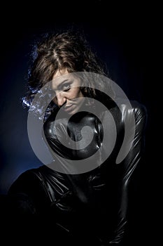 brunette in black latex costume, Fashion shot of a woman in