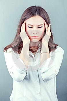 Brunette business woman headache touch head with finger