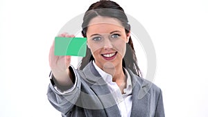 Brunette businesswoman showing a business card