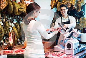 Brunette choosing iberico and serrano