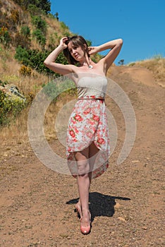 Brunette on a dirt road