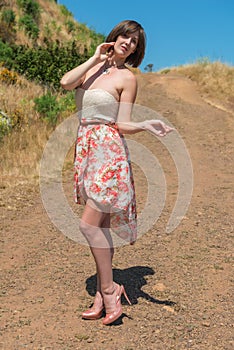 Brunette on a dirt road